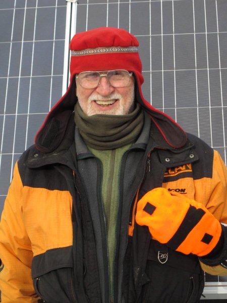 Lynn in layers by the solar panels