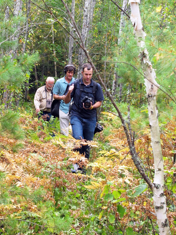 Lynn Rogers, MPR reporter Dan Kraker, and MPR photographer Derek Montgomery returning from visiting June - Aug 30, 2012