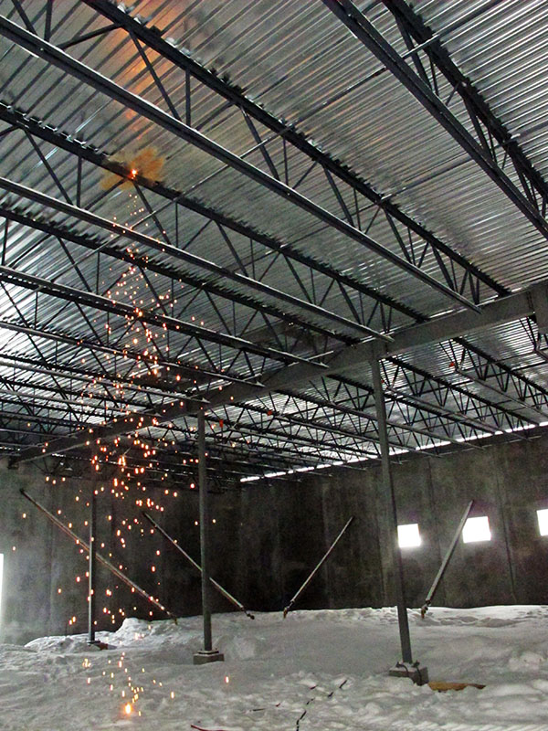 Sparks fly as roof is welded in place - Feb 7, 2013