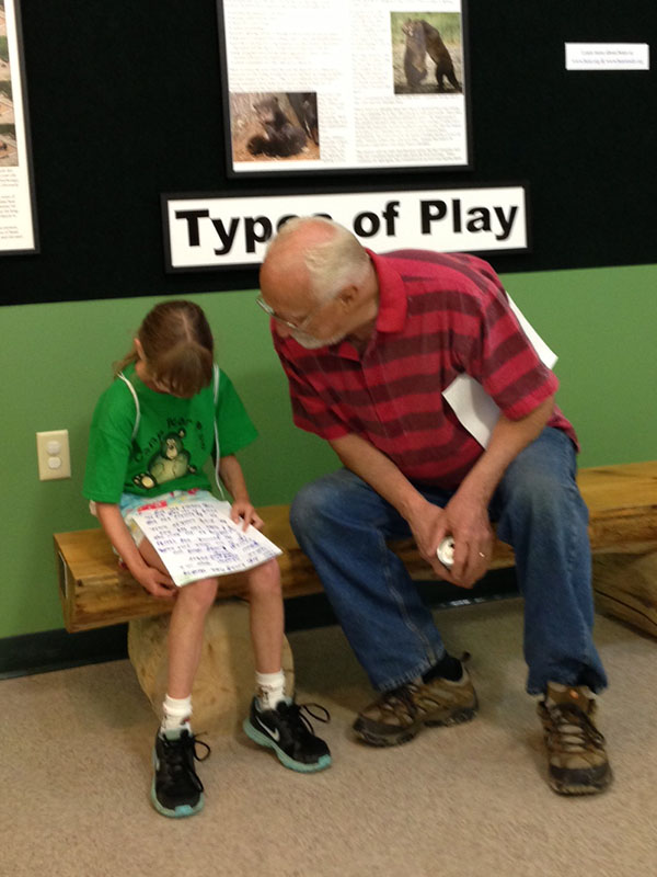 Lynn listens to camper's story