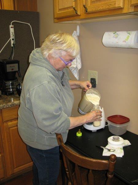 Sharon Herrell pouring formula for Holly on 4/11/14