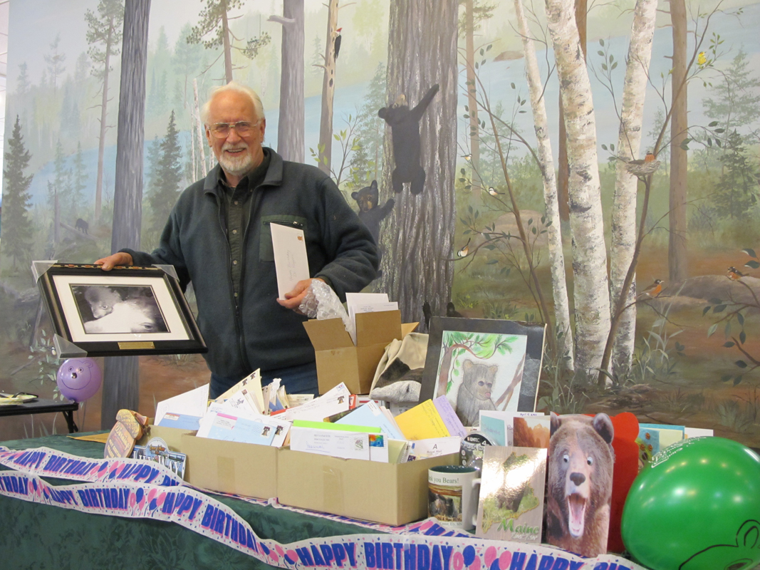 Lynn Rogers with cards and presents